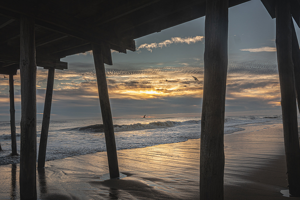 Beneath the Pier at Sunrise by Richard Mathis